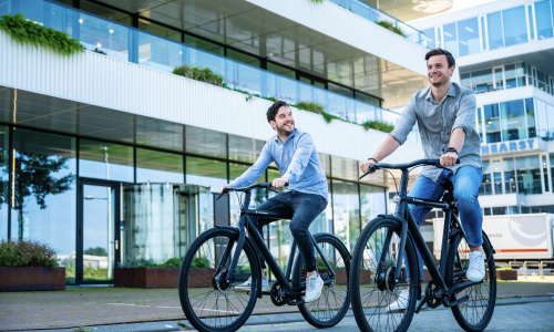 Cycling colleagues outside an office